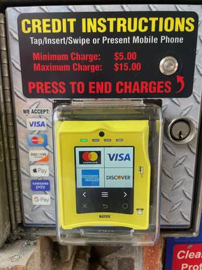 Credit card payment reader in car wash bay